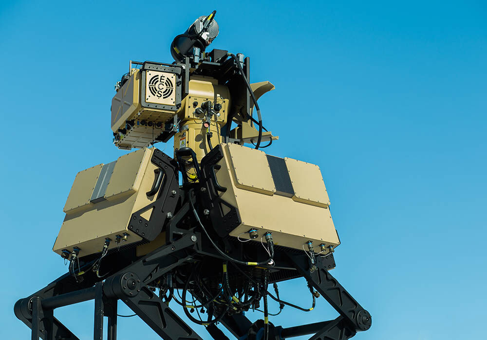 Picture of Numerica's Spyglass radar system outdoors with a blue sky, displaying the radome covers in use.