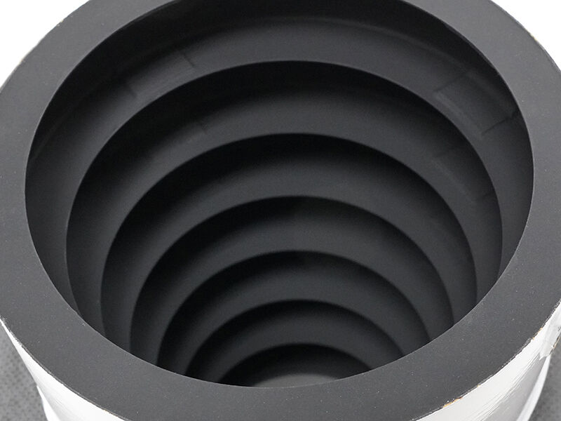 Image shows the interior of a sunshade structure. The interior is carbon fiber (black) and there are layers of cylindrical cutouts evenly spaced down the interior.