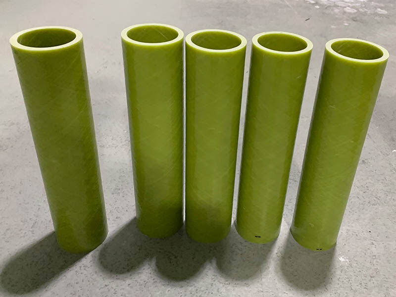 Yellow battery tubes. 5 standing on a warehouse floor