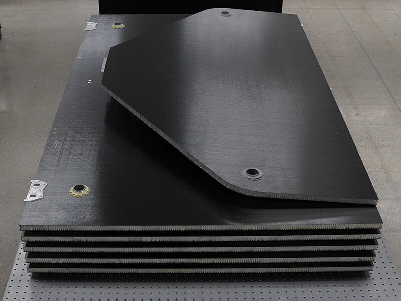 Stack of carbon fiber panels with precision inserts that make up a solar wing. 