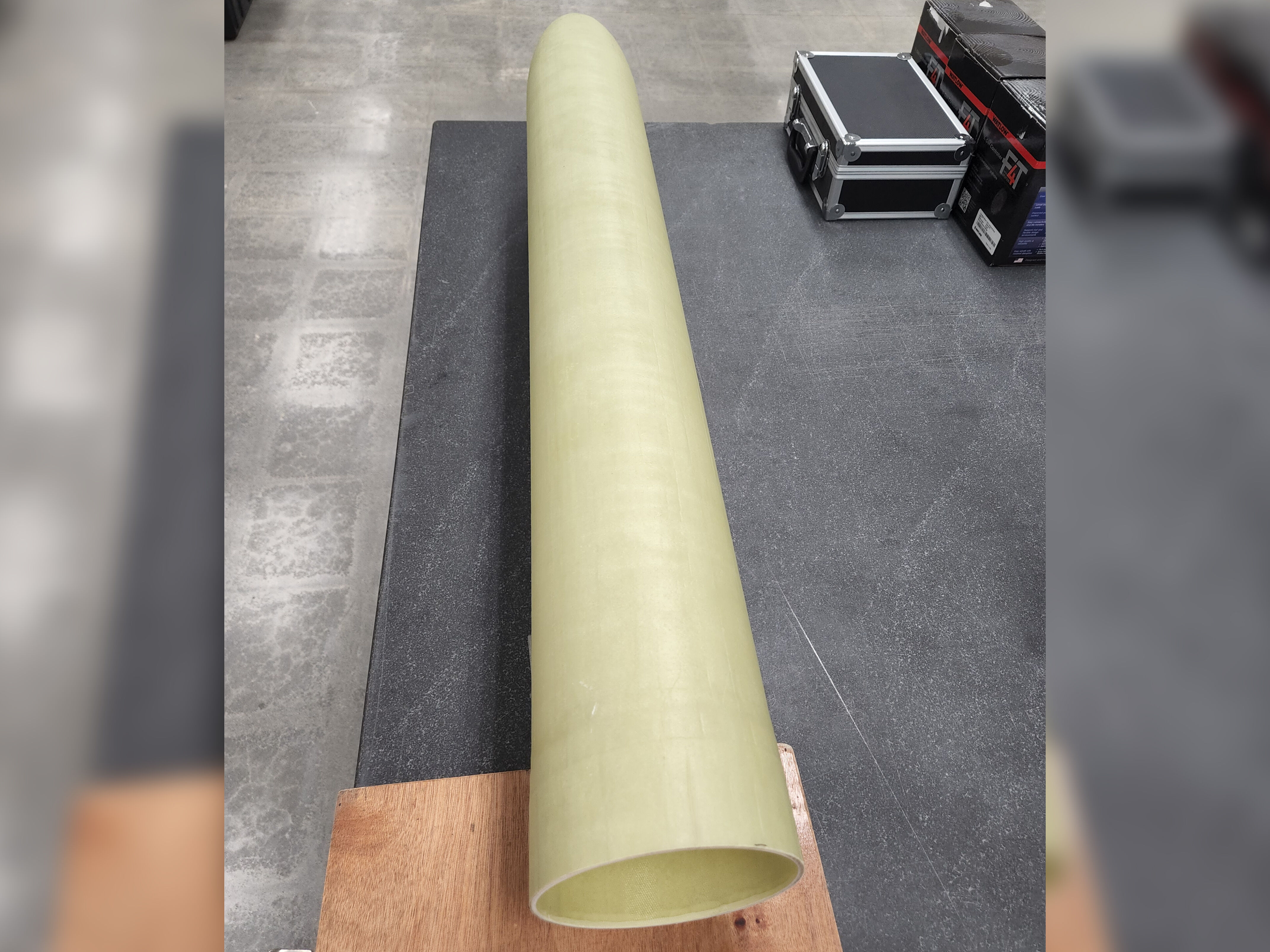 Underwater RF apparatus. Fiberglass long conical shape sitting on a granite table. 