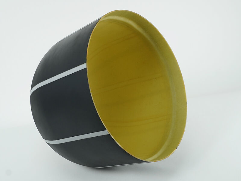 Satcom aircraft radome. Black paint exterior with white lightning diverters and yellowish interior. Radome is on it's side.