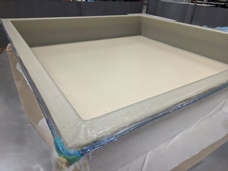 Radome under manufacture. Composite material is laid up in a tool, bagged, and under a vacuum to debulk the material before the next stage of the manufacturing process.